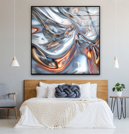 An abstract chrome silver glass wall art with a luminous metallic sheen and copper glow reflections.