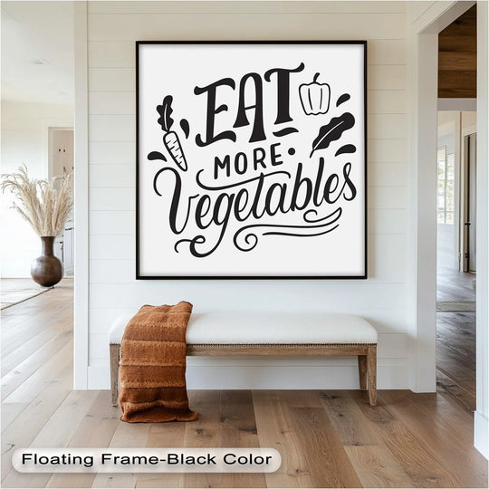 High color contrast highlights the black 'Eat More Vegetables' oil painting wall art against the bright white backdrop and adjacent white bench.