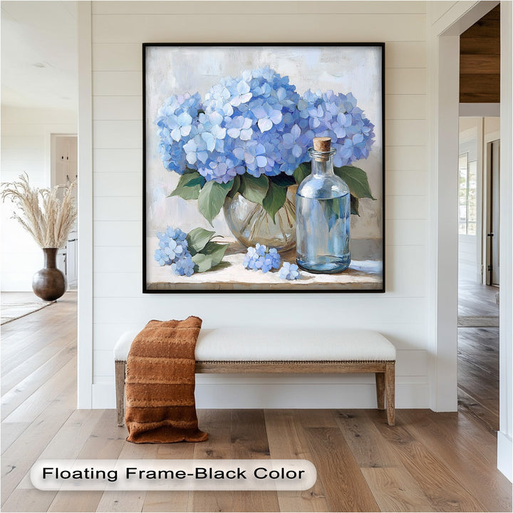 Charming blue floral bouquet in glass vase with decorative water jar.
