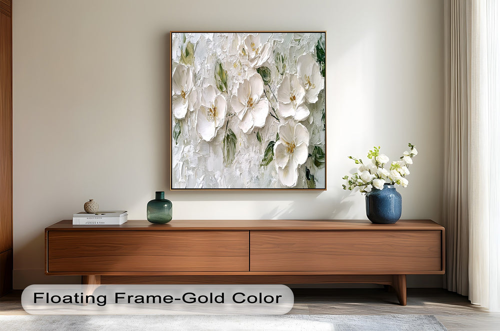 Elegant white flower wall art featuring rich texture and natural green accents.
