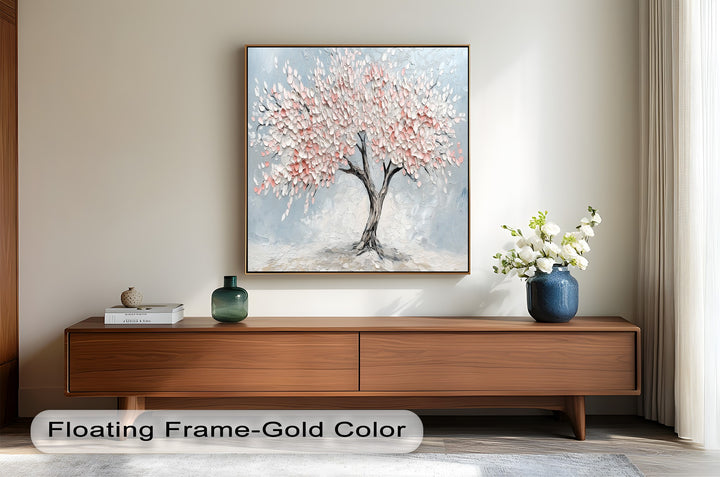 Textured floral artwork of a delicate pink blossom tree.
