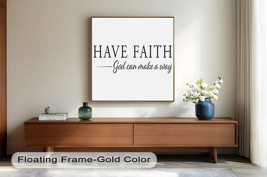 Foreground shows the warm, wooden TV console and gray rug beneath a gold-framed 'Have Faith' oil painting artwork, enhancing the room's comforting ambiance.