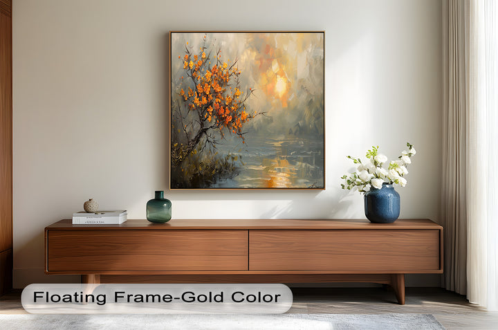 A sophisticated framed artwork featuring a windswept tree in bloom, overlooking a tranquil body of water with a dreamy, abstract sunset sky.