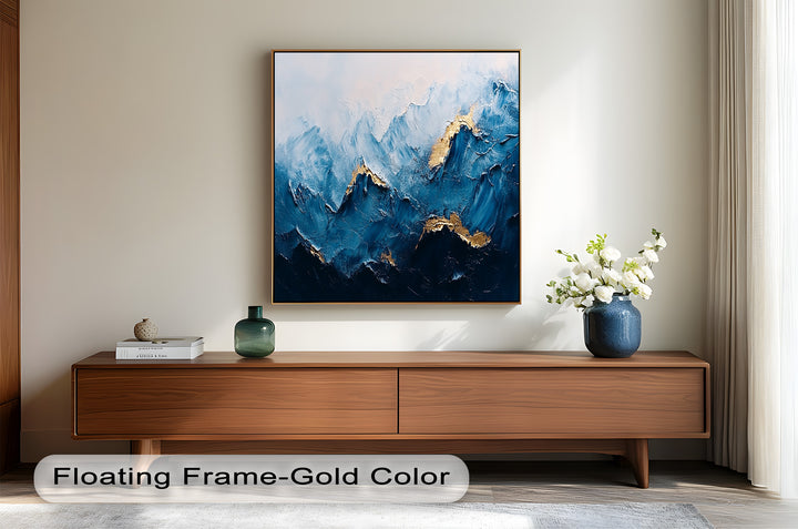 Modern mountain wall art with bold brushstrokes and shimmering gold details.
