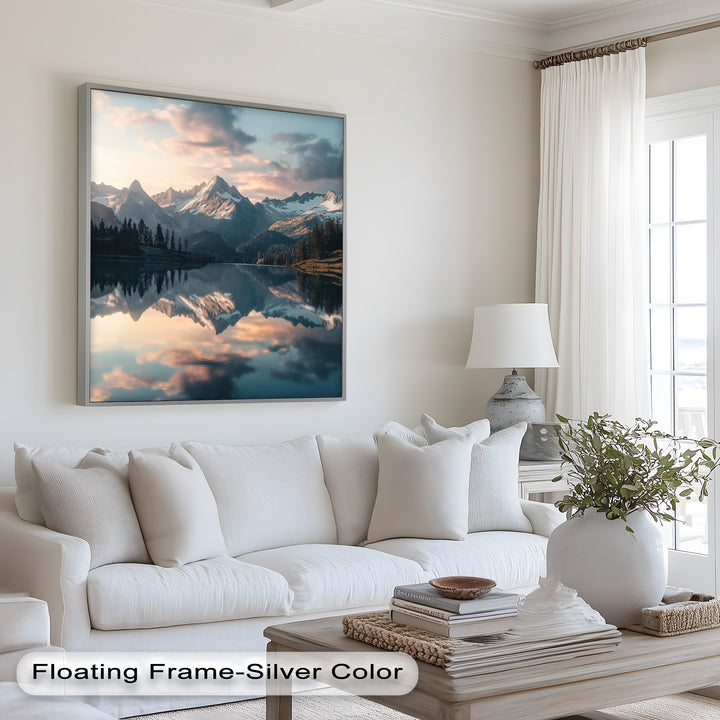 Peaceful mountain scene with glowing sky and glassy water.
