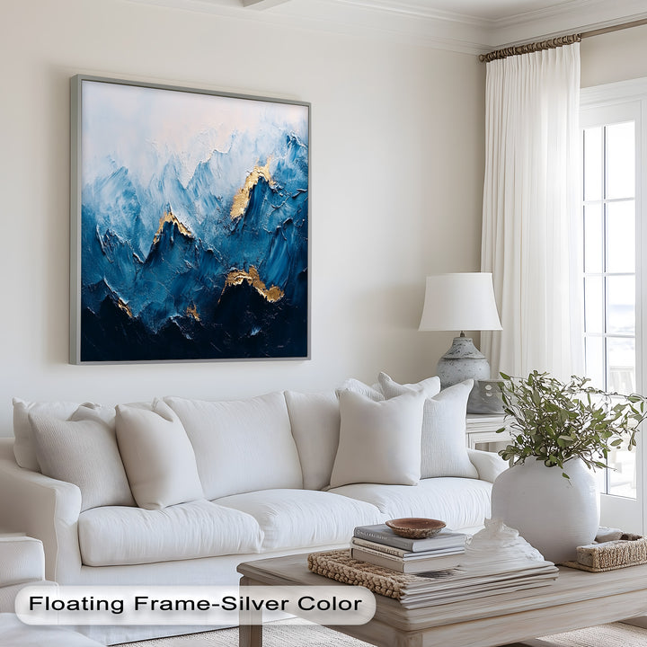 Contemporary abstract painting of rugged mountains in blue and gold.
