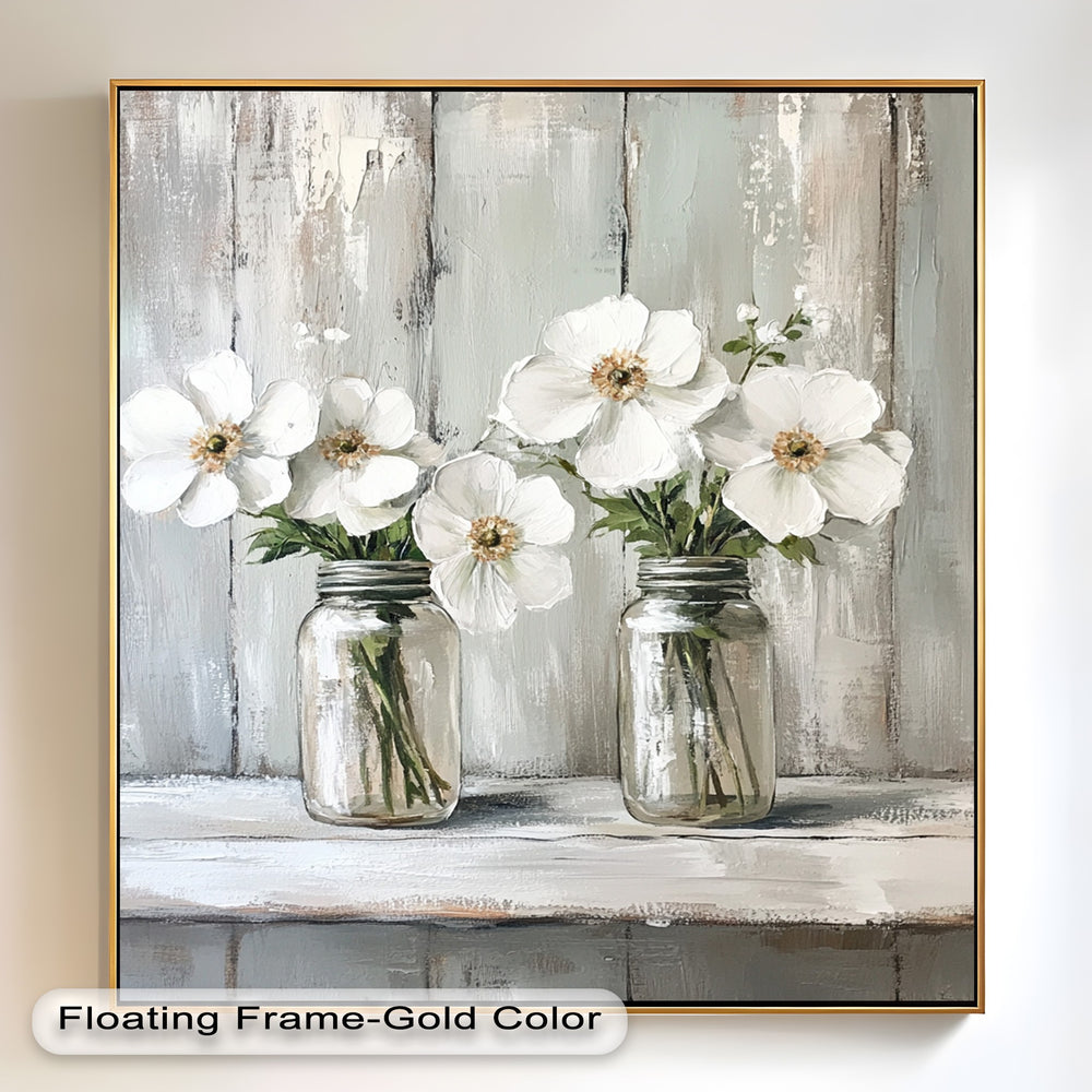 Rustic floral still life with white blossoms in mason jars.
