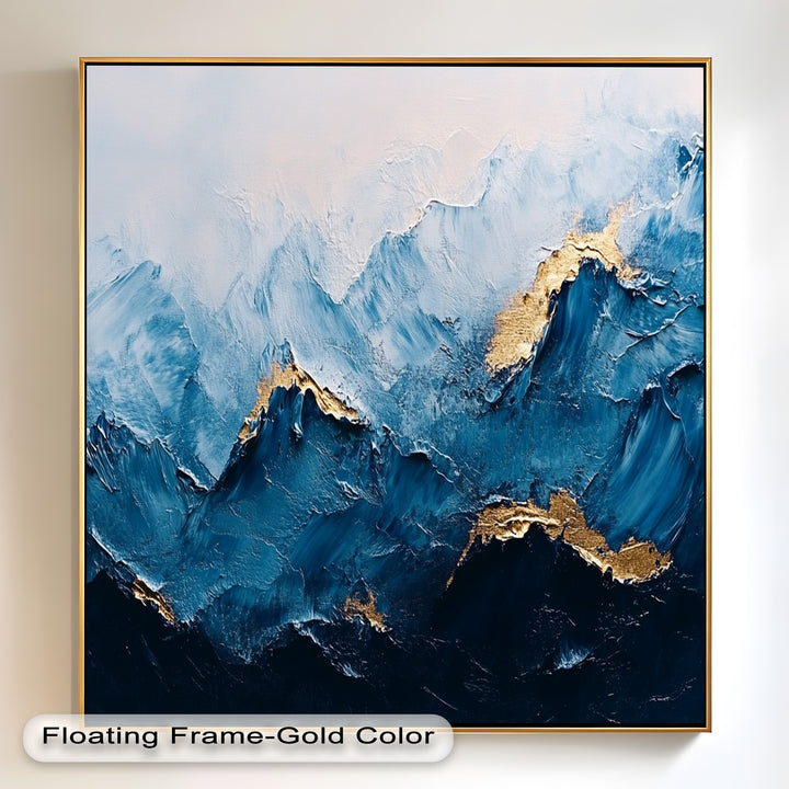 Textured mountain painting with rich blue tones and metallic gold highlights.
