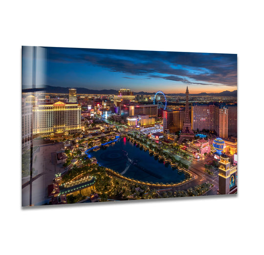 Visual rhythm is created through the varying heights of buildings and lights in this Las Vegas skyline glass printing, resulting in a vibrant night cityscape art piece.