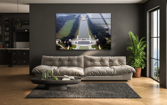 With cool hues dominating, this decorative wall art glass print captures an aerial view of the Washington DC Lincoln Memorial and Reflecting Pool.