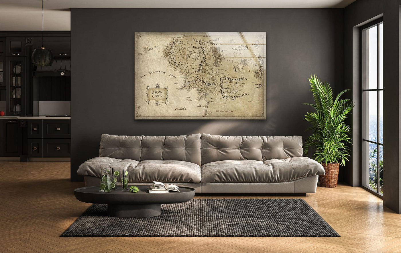 Alternating light and dark elements create a pleasing visual rhythm in this vintage Middle Earth map fantasy tempered glass wall art, displayed above a modern couch.