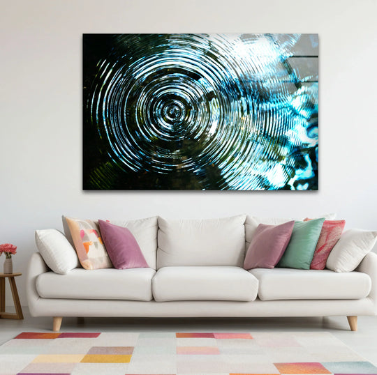 Thick glass print borders frame a mesmerizing blue circular water ripple effect, perfect for hanging wall art.