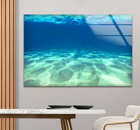 Showing the layering effect, this underwater ocean floor scene is a tranquil blue sea design among wall art prints in glass.