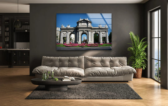 Evoking a serene mood, the Puerta de Alcalá print wall art adds an elegant focal point above a cozy sofa, offering a sophisticated touch to any space.