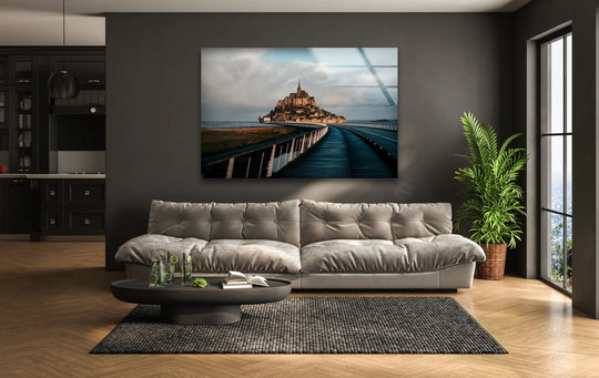 High color contrast accentuates the Mont Saint-Michel scenic view in this art from glass wall art, featuring the iconic French landmark under a dynamic sky.