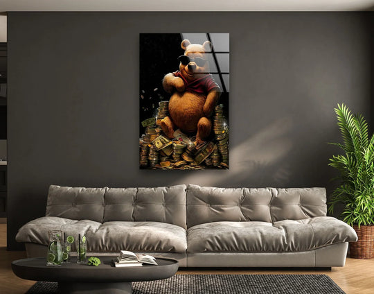 Vibrant golden hustle glass wall art showcases a cool bear lounging on stacks of cash, employing high-quality glass printing for a striking visual statement.