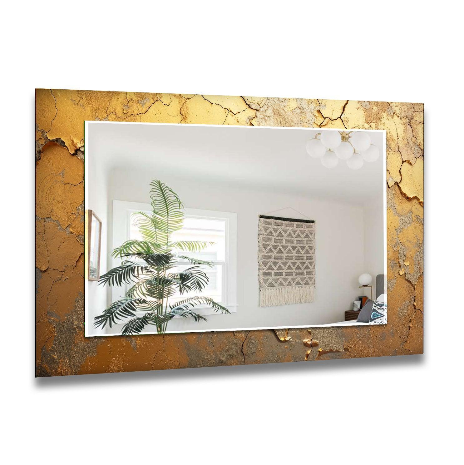 The heavily textured, cracked gold edge of this bathroom mirror frames the reflection, creating a unique modern wall decor piece with an abstract design.