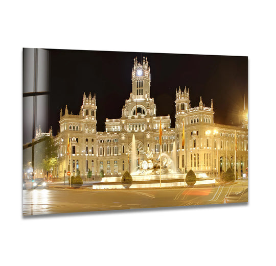The enchanting mood of this Cibeles Fountain hanging wall art captures the iconic Madrid landmark gleaming with light, presenting a majestic and grand nighttime cityscape.