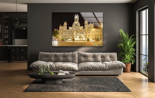 Bold color contrast defines this iconic Madrid landmark, Cibeles Fountain, tempered glass wall art, with its illuminated fountain against the dark night sky.