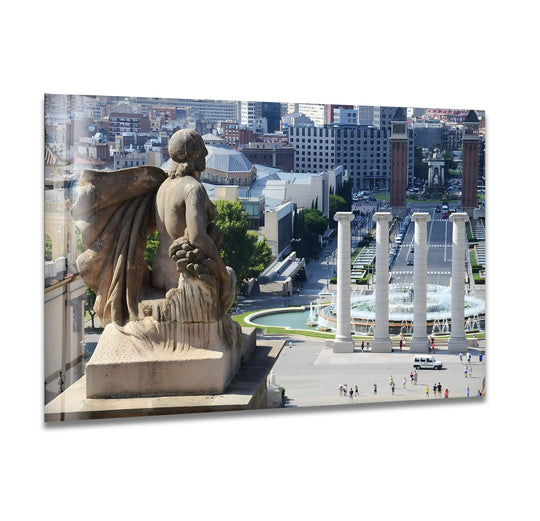 Beige tempered glass wall art showcases an elevated view of the Barcelona cityscape with prominent architectural elements in muted, earthy tones.