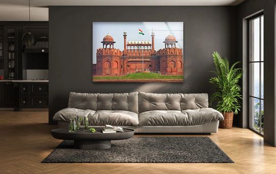 Showcasing the Red Fort, this hanging wall art glass print, with its vibrant colors and a majestic view, becomes the loudest element in this contemporary living space.