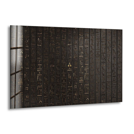 This tempered glass wall art features golden Egyptian hieroglyphs transitioning from light to dark on a textured black background.