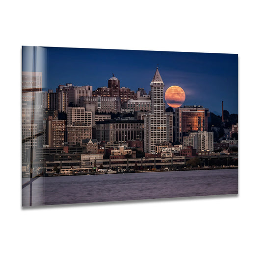 Featuring the edge and borders of Seattle skyline glass wall art displaying a majestic cityscape with a rising moon, enhancing your home decor.