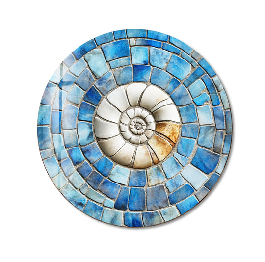 The concentric mosaic tiles create a sense of swirling motion within this coastal fossil spiral round glass wall art print, bringing dynamic energy to the design.