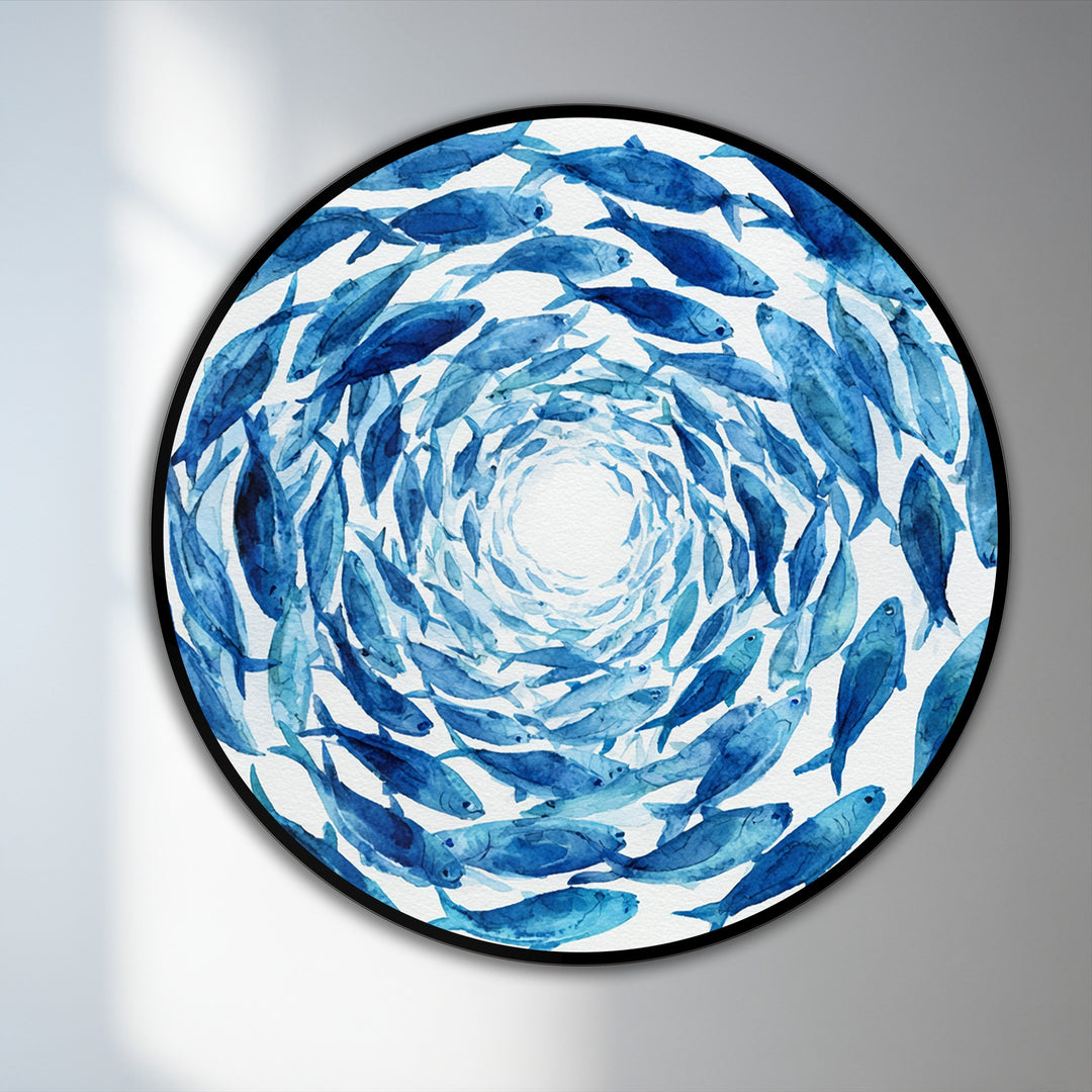 Gradual shading highlights the transition from a white center to deep blue hues in this round oil painting art piece of a blue spiral school of fish on wood.