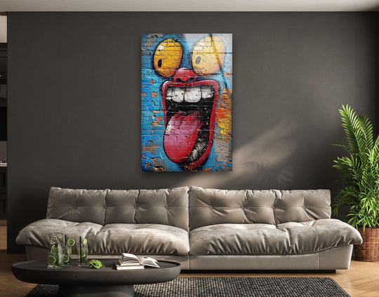Abstract graffiti art of a cartoon face with bulging eyes and a wide, screaming mouth in vibrant colors serves as striking home decoration.