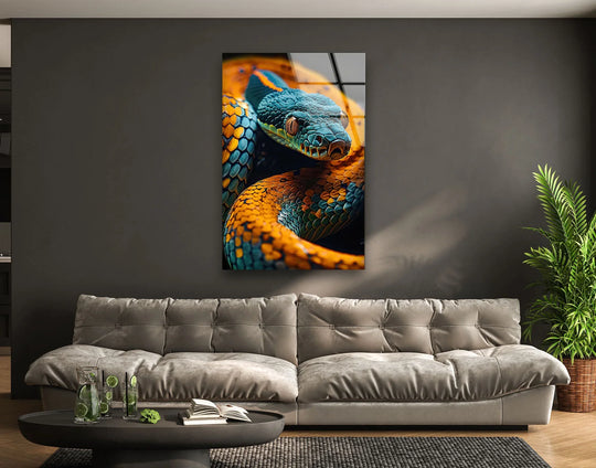 Negative space showcases a striking blue snake glass wall artwork with vibrant orange accents.