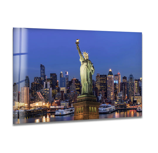 City Prints glass wall art Statue of Liberty and iconic New York landmark with illuminated skyline against evening glow