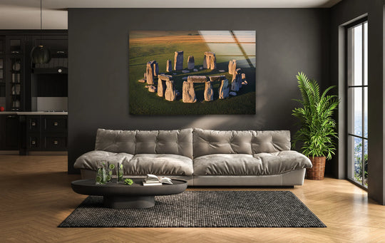 The focal point is Stonehenge aerial view glass wall art, a stunning piece of home decoration that captures the iconic ancient wonder in golden sunlight.