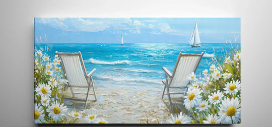 Abundant daisies in the foreground add soft beauty to this beach-themed canvas wall art featuring serene beach chairs overlooking sailboats on the water.