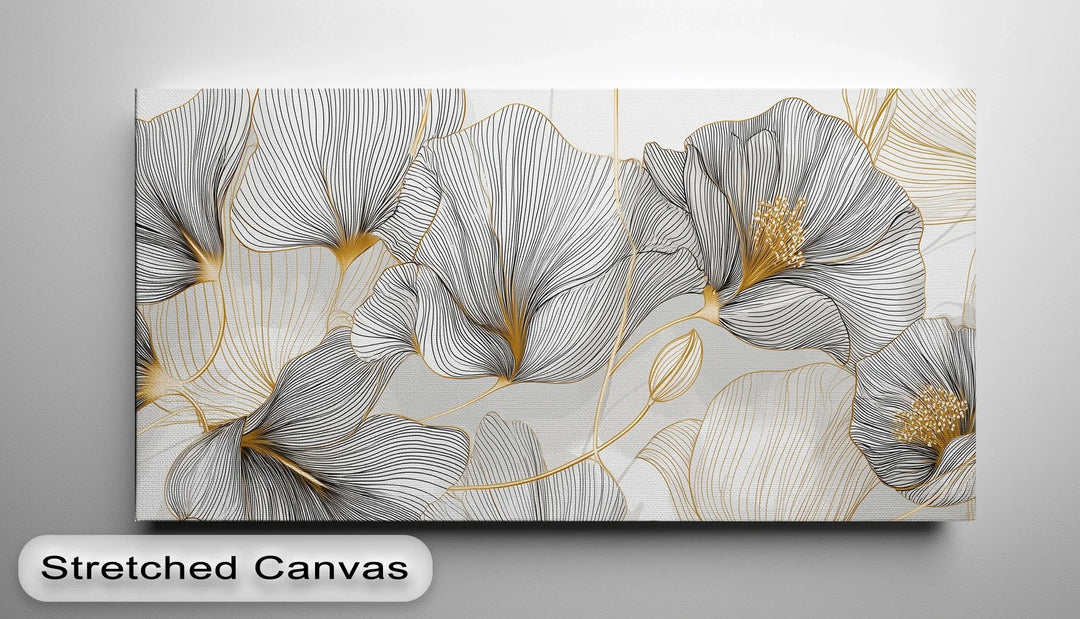 Gold accented botanical wall art with monochrome abstract flower design

