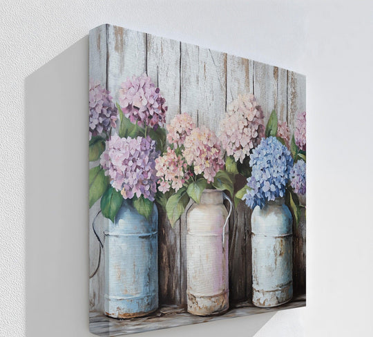 The stillness of this rustic kitchen canvas painting captures hydrangeas in milk cans, presenting a serene floral scene as canvas prints.