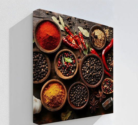 Seen through hanging canvas, the textured white background highlights a vibrant arrangement of spices in wooden bowls.