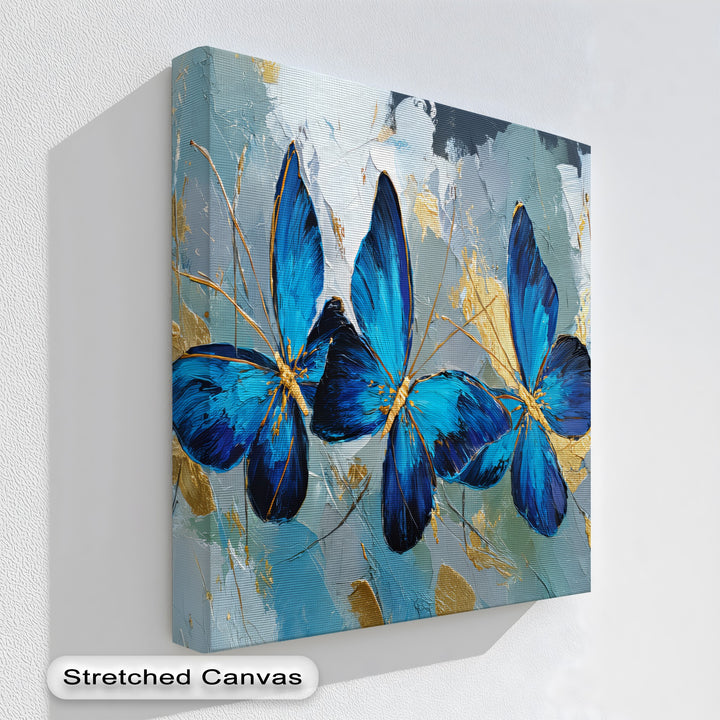 Trio of Radiance – Bold Blue Butterfly Canvas Print