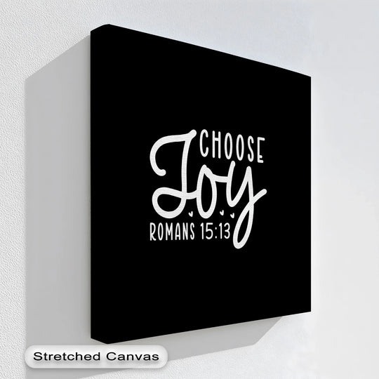 Negative space surrounds the optimistic 'Choose Joy' message on this contemporary black background canvas artwork print, providing a minimalist design.