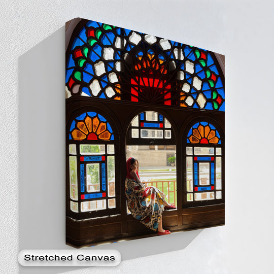 Negative space highlights the ornate window framing a woman on this canvas print, a fine example of canvas pictures with Persian geometric elegance.
