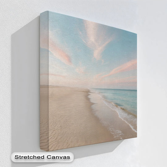Soft color saturation enhances the peaceful mood of the serene pastel shoreline canvas wall decor print, depicting a tranquil beach and pastel sky.