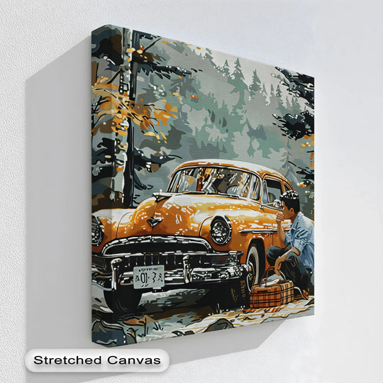 Central subject is a big canvas print featuring an orange vintage car stopped for an autumn picnic in the forest with a man sitting beside it.