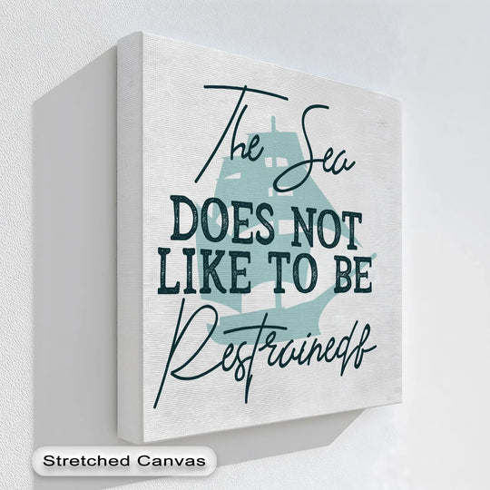 Flowing script and ship silhouette suggest organic forms within this inspirational premium canvas decor print, 'Untamed Sea'.