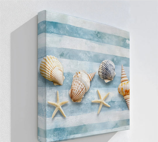 The stillness of this coastal canvas print captures seashells and starfish arranged on blue stripes, offering big canvas prints with nautical elegance.