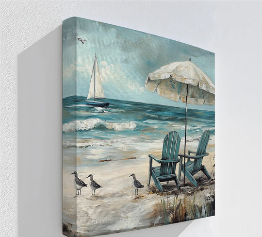 Foreground detail of tranquil seaside escape canvas pictures showcasing beachside birds and vegetation leading to serene beach chairs under an umbrella.