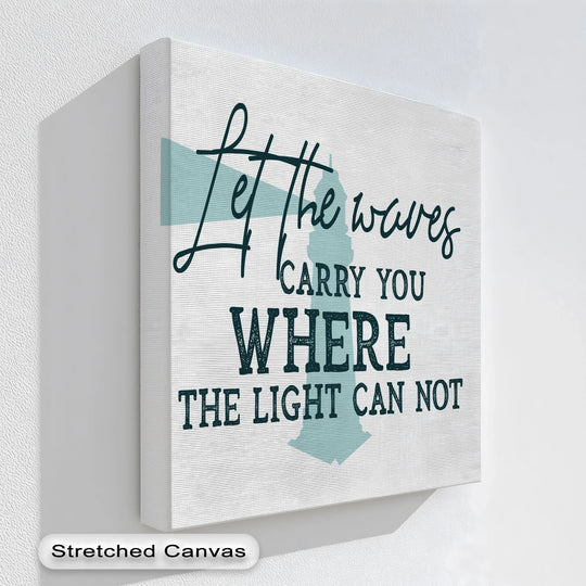 Stillness captured in this unique canvas print showcases the serene lighthouse quote, 'Let the Waves Carry You,' creating a calming atmosphere.