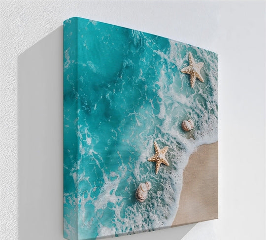 Turquoise hues dominate this beach-themed framed canvas print featuring starfish and seashells on a sandy shore.