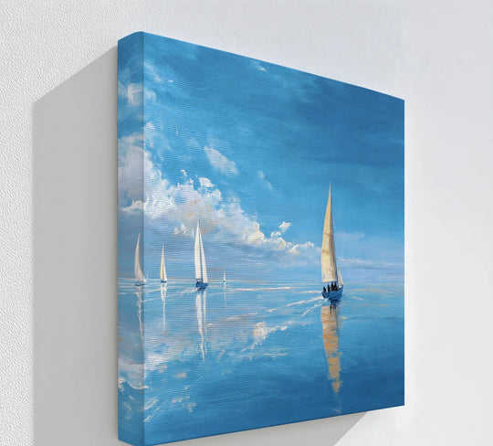Geometric elements highlight the serene composition of this tranquil sailboats at sea canvas wall art, where reflections form sharp triangles in the blue ocean.