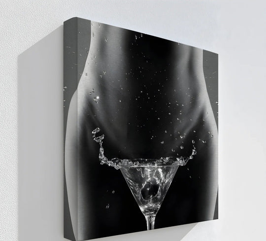 Dramatic negative space emphasizes the martini glass within the abstract female form of this splash art canvas wall art print.