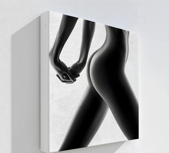 Muted color saturation enhances the striking monochrome tones of this minimalist female silhouette canvas wall decor print, accentuating the subtle gradations of light and shadow.